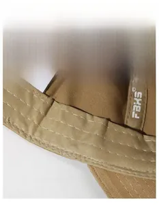 Macro shot of wide cotton sweatband with white reinforced stitching inside khaki baseball cap