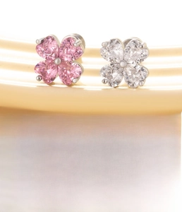 Detail view of pink and clear heart-shaped zircon clover stud earrings in titanium steel