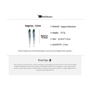 Detailed view of long blue rhinestone jellyfish tassel earrings with silver needles