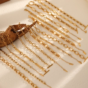 Golden 304 stainless steel DIY bracelet chains displayed on textured natural background