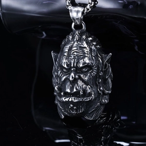 Macro shot of punk orc skull pendant in aged stainless steel with fine skin texture details
