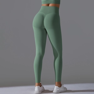 Detail view of seamless high waist green yoga leggings with scrunch butt lifting effect