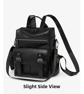 Close-up of black soft leather backpack featuring vintage tassels and decorative buckles