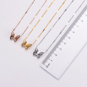 Detailed butterfly pendant dimensions shown with a ruler in rose gold, gold and silver