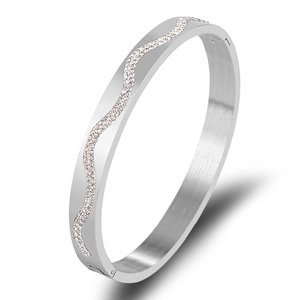 Polished stainless steel wavy bangle with sparkling crystals in silver finish