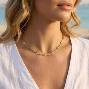 Chic gold fishbone pendant necklace in stainless steel for women beach vacation style