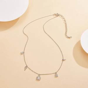 Detailed view of S925 silver necklace featuring zircon-encrusted lock and key pendants
