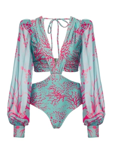 Detail of long sleeve cutout swimsuit with pink coral print and deep V-neckline