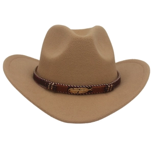 Detail of western cowboy hat featuring ethnic belt and golden metal feather pendant