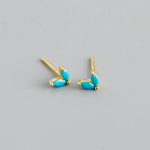 Close-up of gold-plated S925 silver stud earrings with marquise-cut turquoise stones