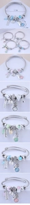 Detailed view of DIY bead charms bangles with angel pendants and crystal beads in four colors