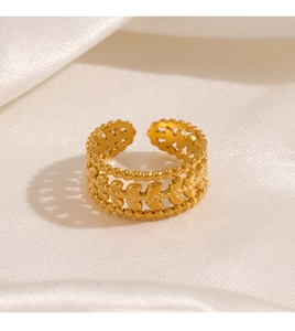Macro detail of 18K gold plated three-layer leaf ring with bead edges on silk background