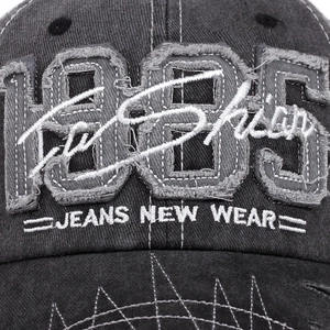 Distressed dark grey cotton baseball cap with 1985 embroidery and vintage patchwork