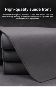 Detailed texture of thick dark grey suede cleaning cloth for precision instruments