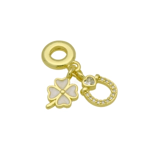 Detail of 18k gold plated four-leaf clover and horseshoe charm with heart-shaped stone