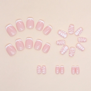 Short T-shaped press-on nails with French tips and pink zebra animal print designs