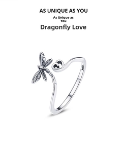 Macro shot of S925 sterling silver dragonfly heart ring with vintage texture details