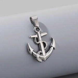 Close-up of vintage silver stainless steel anchor pendant with intricate rope detail