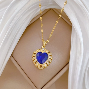 Luxurious heart pendant necklace with deep blue gemstone and gold-plated chain