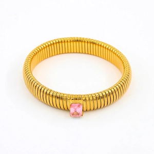 Detailed view of gold flexible snake bracelet with a rectangular pink zircon center stone