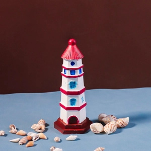 Mediterranean lighthouse ornament in red and white resin with decorative shells