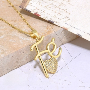 Detailed macro of a 18k gold plated Fe heart pendant necklace with zircon inlays