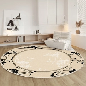 Close-up of circular loop pile kitchen mat with floral patterns on light wood floor