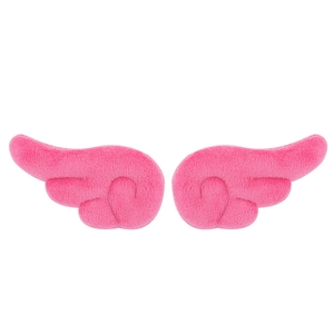 Macro view of pink plush angel wings accessories for DIY clothing and hair decor
