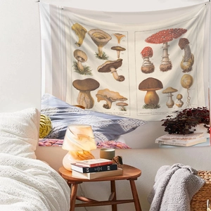 Detail of vintage botanical mushroom tapestry hanging in a cozy bedroom setting