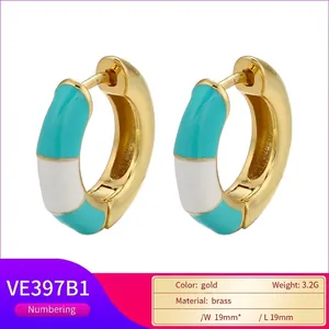 Gold-plated brass C-shaped hoop earrings with turquoise and white enamel inlay