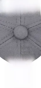 Detail of grey baseball cap showing embroidery logo and adjustable metal buckle
