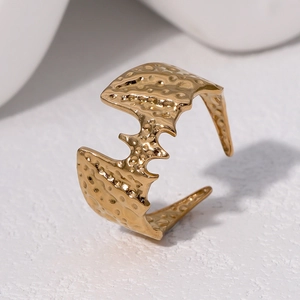 Golden stainless steel bat ring with irregular hammered texture and adjustable open band