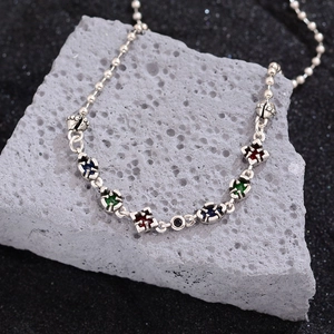Hip hop bead chain necklace with colorful zircon star pendants on natural grey rock