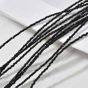 Detailed view of 2-2.5mm black mother of pearl mini round beads for DIY jewelry making