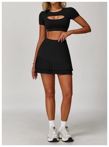 Front view of black pleated sports skirt set with hollow-out short sleeve top