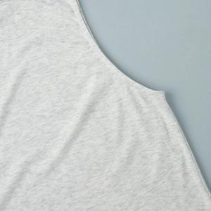 Close-up of heather grey knit vest featuring premium stitching and soft marled texture