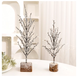 Macro detail of decorative Christmas trees with natural wood bases and icy crystal branches