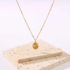 Golden mermaid princess portrait pendant necklace on minimalist beige stone background