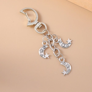 Vintage silver star and moon keychain with three moon pendants on a metal ring