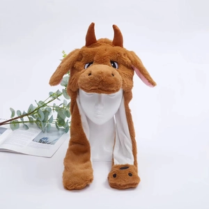 Detail of plush animal hat with movable long ears and cute brown cow horns for kids