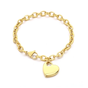 Polished gold heart pendant on a chunky cable chain bracelet, minimalist chic style