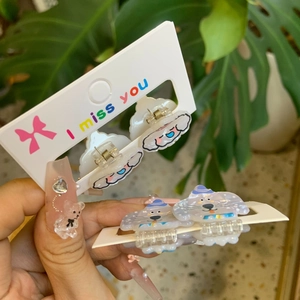 Detail of cute acrylic cartoon hair clips with puppy motifs on display cards