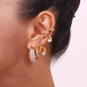 Gold plated J-shape ear clips with four pearls and rhinestones on a female model