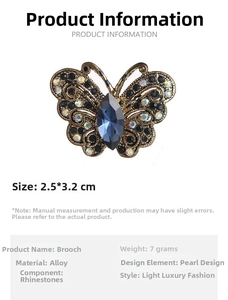 Detailed butterfly brooch with blue marquise crystal and rhinestones, size 2.5x3.2 cm