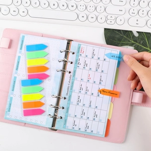 Pink PU leather A6 binder planner with colorful index tabs and monthly calendar layout