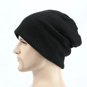 Detail of black ribbed knit beanie showing textured warm fabric and skull cap fit