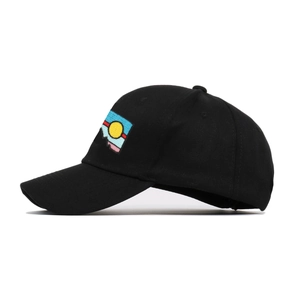 Black cotton baseball cap featuring colorful sunset embroidery on the side profile