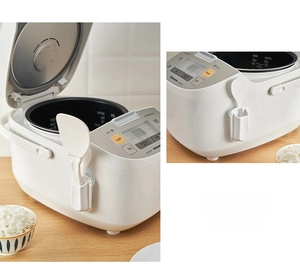 White plastic rice paddle holder with suction cup attached to side of rice cooker