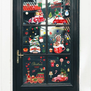 Christmas window decals showing red Santa car and steam train on glass door decor