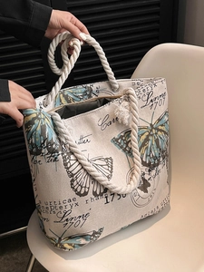 Large canvas tote bag with butterfly print and thick cotton rope handles for beach and casual use